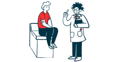 A doctor talks to a patient seated on an exam table.