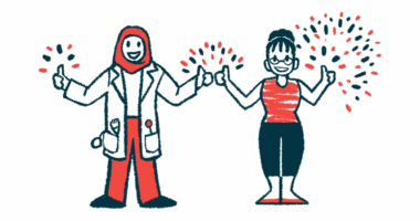 Fireworks explode around the hands of a doctor and patient standing side by side and each giving a double thumbs-up sign.