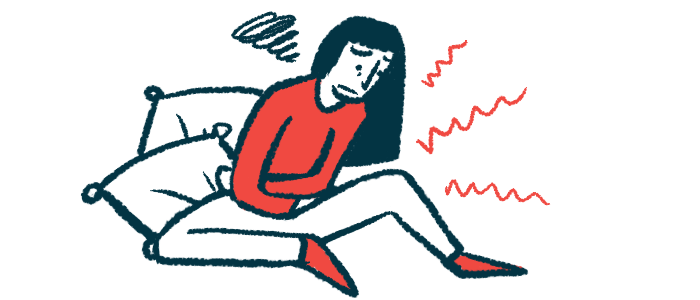 A person seated against pillows and clearly in pain crosses both arms against the belly.