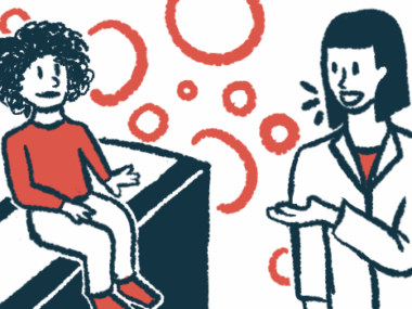 A doctor speaks to a child sitting on an exam table.