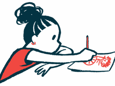 A child sits at a table and draws a picture on a sheet of paper.