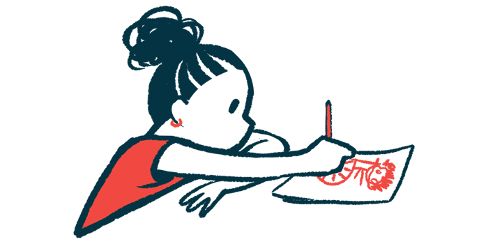 A child sits at a table and draws a picture on a sheet of paper.