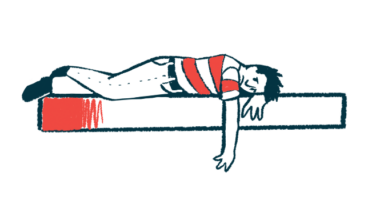 A person in a red and white shirt lies face down on a slab with one arm dangling over the side.