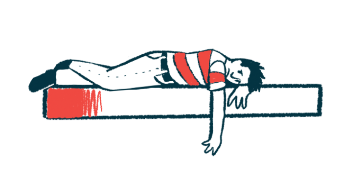 A person in a red and white shirt lies face down on a slab with one arm dangling over the side.