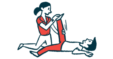 A person in red pants has their leg stretched by a physical therapist.
