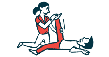 A person in red pants has their leg stretched by a physical therapist.